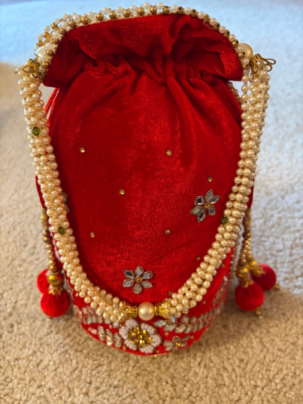 Red Embellished Velvet Potli Bag with Faux Pearl Strap and Drawstring Handles
